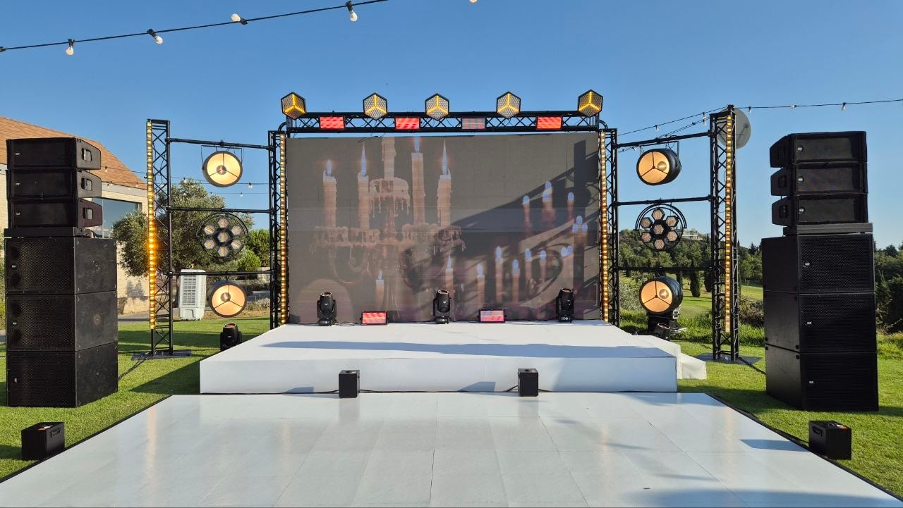 Complete stage production bundle with staging decks, truss frame, LED wall, and sound